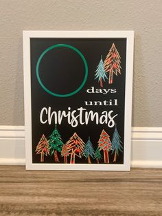 a christmas card with trees and the words o days until christmas written on black paper