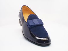 Style: 525-210SP-Blue Exquisite combination of Patent Leather & Suede accent this slip-on Dress Loafer from Carrucci, featuring Grosgrain Bow and Piping, and a clean welt! Elegant Blue Slip-on Leather Shoes, Blue Leather Work Shoes, Blue Slip-on Dress Shoes For Semi-formal Occasions, Blue Formal Slip-ons With Leather Sole, Formal Blue Slip-ons With Leather Sole, Blue Slip-on Formal Loafers, Blue Dress Shoes For Work, Fitted Blue Dress Shoes For Office, Elegant Blue Leather Slip-on Shoes