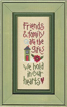 a cross - stitch picture frame with the words friends and family are in the sky