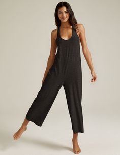 This light-as-air jumpsuit is your new comfort secret weapon, and the most versatile style in your closet: sleep in it. Lounge in it. Throw it on over your swimsuit. Or slip into it when the workday ends. It's relaxed fit and carefree make it an absolute essential. Designed and assembled in the USA Relaxed ﬁt Racerback detail Cropped length Uniquely created to flatter every shape Every style we produce is wear-tested on our in-house team to ensure the best fit in every size Yogi Style Outfits, Loose Workout Outfits, Massage Outfits For Women, Yoga Retreat Outfits, Massage Therapist Outfit, Yoga Jumpsuit Outfit, Yoga Style Fashion, Yoga Onesie, Yoga Outfits For Women