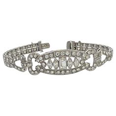 Antique Art Deco Diamond bracelet meticulously crafted with 4.5 to 5 carats of old European, baguette, and marquise-cut diamonds. The double-row diamond line bracelet has a wider central motif of marquise and baguette cut diamonds. The impressive fillagree detail throughout the bracelet creates a timeless elegance and a classic masterpiece. It is expertly crafted to embrace the wrist with a luxurious feel, creating an enchanting adornment that seamlessly fuses comfort with glamour. This antique Bracelet Tennis, Art Deco Bracelet, Marquise Cut Diamond, Baguette Cut Diamond, Art Deco Diamond, Antique Art Deco, Baguette Cut, Baguette Diamond, Marquise Cut