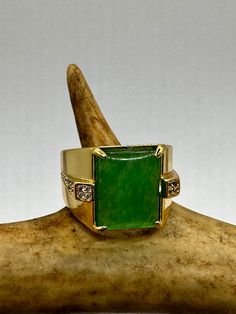 vintage green fun jade ring  Setting is a golden finished bronze setting  This is one of my hand re finished treasures. Salvaged from vintage.  Size   9.5 Re sizing can be done for a $20 fee and may take up to a week.  Engraving is $4 per letter.  Thank you for supporting a veteran's small business. All jewelry is shipped free within the US in a stylish gift box  PLEASE NOTE If we have multiples of the same vintage item, it is because we often purchase factory remnants or odd lots. Likewise, if Vintage Green Rings With Stone Setting, Heirloom Jade Jewelry In Green, Heirloom Green Jade Jewelry, Vintage Jade Gemstone Jewelry, Antique Green Ring With 17 Jewels, Vintage Jade Jewelry For Anniversary, Antique Green Emerald Ring Collectible, Collectible Gold Emerald Gemstone Ring, Antique Green Emerald Collectible Ring