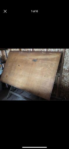 an old wooden table sitting in the middle of a room