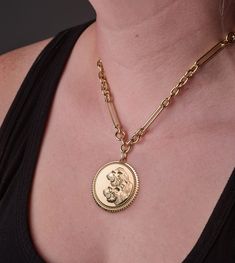 Description Handcrafted in 18K Yellow Gold, this Exuberant Solar/Lunar Strength Medallion, is a bold reminder that Strength is within. We all have it, but sometimes it wanes, and we need to call on it. The lion symbolizes strength, dignity, passion, self-confidence, and solar energy. The tiger represents a quieter, steely strength. It is fierce; soft but powerful, moves with grace and stealth, embodying lunar energy. We all have both solar and lunar energies inside of us. Sometimes it takes grea Yellow Gold Medallion Brass Chain Necklace, Yellow Gold Brass Medallion Necklace, Yellow Gold Brass Medallion Chain Necklace, Yellow Gold Medallion Chain Necklace Engraved, Engraved Medallion Chain Necklace In Yellow Gold, Hallmarked Yellow Gold Medallion Pendant Necklace, Hallmarked Yellow Gold Pendant Medallion Necklace, Yellow Gold Brass Chain Necklace With Coin Pendant, Solar Lunar