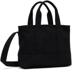 Cotton canvas tote in black. · Twin rolled carry handles · Fixed crossbody strap · Logo printed at face · Lobster-clasp closure · Patch pocket at interior · Cotton twill lining · H8 x W10 x D3.5 Supplier color: Black Utility Tote Bag, Kenzo Paris, Utility Tote, Denim Tote Bags, Denim Tote, Small Tote, Black Tote Bag, Blue Bags, White Bag