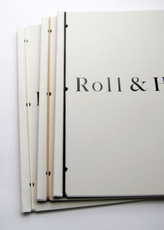 three books are stacked on top of each other with the word roll & hide printed on them