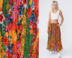 "Vintage 90s broomstick skirt in a colorful floral print. Maxi length with a drawstring waist.  Please see measurements and condition below. Every garment we sell is authentic vintage and one-of-a-kind! You will receive the exact item photographed. Condition: Very good vintage. Best fits: Labelled large Tag: Revue Material:  Labelled Cotton MEASUREMENTS Taken from seam to seam while the garment is lying flat. Double the armpit, waist, and hips For reference, model is 5'8\" and measures 31-23-34. Bohemian Multicolor Print Skirt For Spring, Multicolor Retro Skirt For Vacation, Retro Multicolor Skirt For Vacation, Retro Festival Skirt For Spring, Retro Skirt For Spring Festival, Vintage Skirt For Spring Festival, Multicolor Floral Print Skirt For Festival, Vintage Multicolor Skirt For Spring, Hippie Multicolor Maxi Skirt