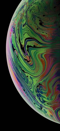 an iphone with colorful swirls on the screen and black backgroung background