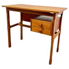 a small wooden desk with two drawers on one side and an open drawer on the other