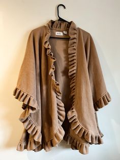 Super cozy fleece shawl! Love the ruffles on this piece and it can be worn and layered in so many ways. Perfect condition. Brown Bohemian Shawl For Winter, Cozy Brown Shawl One Size, Brown Shawl Scarf, Brown Fur Shawl, Cozy One-size Brown Shawl, Shawls And Wraps, Ruffles, Shawl, Scarf Accessory