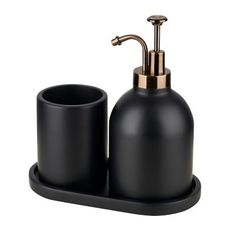 black soap dispenser and cup holder with gold accents on an isolated white background