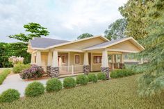 this is a computer rendering of a small house in the country side with front porch