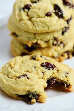 three cookies on a plate with one broken in half