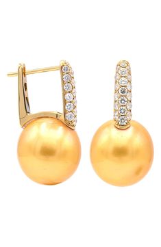 Pavé diamonds bring luxurious sparkle to huggie earrings suspending lustrous pearl drops. Hinge with snap-post closure Pearl size: 12–13mm Total diamond weight: 0.61ct. Color: F–G Clarity: SI 14k gold/pearl/diamond Imported Diamond Guide Elegant Clip-on Huggie Earrings, Formal Yellow Gold Huggie Earrings With Pearl Drop, Formal Gold Huggie Earrings With Pearl Drop, Formal Yellow Gold Diamond Earrings With Pearl Drop, Pear-shaped Yellow Gold Diamond Earrings With Accents, Luxury Yellow Gold Pearl Earrings With Diamond Accents, Yellow Gold Diamond Pearl Earrings With High Luster, Gold Pear-shaped Diamond Earrings With Accents, Formal Round Huggie Earrings With Pearl Drop