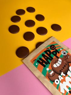 chocolate candies sitting on top of a bag next to an orange and yellow background