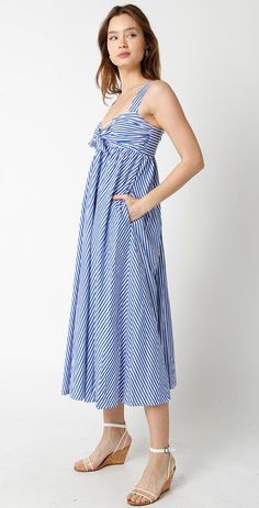 Olivaceous brand blue and white pinstripe midi length dress with a strapless design, a twist front tie detail, and side pockets. Smocking at back Lined Self: 100% cotton Lining: 100% Rayon Hand wash cold Striped Cotton Maxi Dress For Vacation, Cotton Dress With Vertical Stripes For Day Out, Striped Sundress Midi Dress For Daywear, Striped Cotton Maxi Sundress, Striped Summer Maxi Dress For Daywear, Striped Dresses With Pockets For Vacation, Chic Striped Cotton Maxi Dress, Blue Maxi Dress With Pockets For Daywear, Blue Vertical Stripes Dress For Daywear