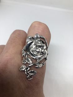 Lovely and delicate Rose flower ring 925 Sterling silver with black rhodium Size 6 or 9 or 10 can be re sized for you on request. My jeweler charges $10 All rings are shipped in a nice gift box. Check out our over a THOUSAND great reviews Engraving is $4 per letter and is not always perfect depending on the piece. It can take a few days if the jeweler is busy. This is payable to Paypal Judithsltd@gmail.com Elegant Silver Rings With Rose Design, Silver Flower Ring With Rose Design, Silver Rose Design Ring, Silver Ring With Rose Design, Silver Rose Design Jewelry For Promise Ring, Elegant Silver Rings With Rose Details, Silver Flower-shaped Rings With Rose Design, Silver Rose Ring Jewelry, Silver Flower Ring With Roses For Gift