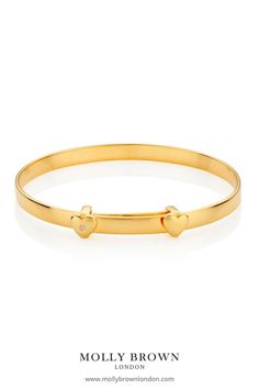 A keepsake token of love, golden sparkles and well wishes. The best-selling My First Diamond Baptism Baby Bangle has been updated with an 18ct gold vermeil touch. A beautiful design, it is the perfect baby bangle to give as a unique goddaughter gift or newborn jewelry. Set with two hearts and a genuine 1pt diamond this timeless, adjustable Baptism baby bangle will expand over the widest part of her hand, lasting her until around the age of three. #baptismgift #christeninggift #babybangle Adjustable Diamond Bracelet With Polished Finish For Gift, Adjustable Polished Diamond Bracelet As Gift, Personalized Adjustable Diamond Bracelet For Anniversary, Anniversary Gold Bracelet With Single Diamond, Adjustable Stackable Diamond Bracelet For Anniversary, Adjustable Diamond Bangle For Anniversary, Adjustable Diamond Bangle As Gift, Adjustable Personalized Diamond Bracelets, Personalized Diamond Bracelets With Adjustable Fit