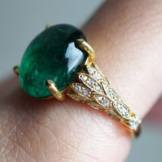 Read about our payment plans before proceeding.This is what dreams are made of. This emerald ring features an insanely gorgeous deep green natural cabochon emerald stone, embellished with 57 natural white diamonds with details like phoenix wings. A classy and sleek ring to treasure forever. Handcrafted in your choice of 14K yellow gold, rose gold, and white gold. The emerald shown is the exact same emerald you will receive. 14K solid gold Natural 12*9mm natural cabochon emerald. Approx. 2.8ct~. Trip Nails, Phoenix Wings, Hall Of Mirrors, Fall Rings, Emerald Diamond Ring, Emerald Stone, Marquise Diamond, Future Plans, Baguette Diamond