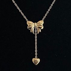 "Bow Drop Heart Necklace  ✨ Fully stainless steel & tarnish proof! (18k gold plated/stainless steel) 15.5\" with a 2\" extender  oval link chain style featuring a unique mini puffed bow pendant & mini heart pendant 🤍 choose between silver or gold at checkout 😊 Handmade with love!" Valentine's Day Stainless Steel Chain Necklace, Heart Pendant Stainless Steel Chain Necklace With Adjustable Chain, Stainless Steel Heart Pendant Chain Necklace With Adjustable Chain, Valentine's Day Stainless Steel Clavicle Chain Necklace, Stainless Steel Heart Necklace With Chain For Gift, Stainless Steel Heart Necklace As Gift, Stainless Steel Heart Necklace Gift, Gold Heart Dangle Necklace With Adjustable Chain, Valentine's Day Gold Plated Clavicle Chain Necklace