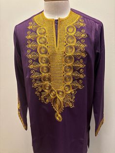 African Purple men top with gold embroidery This is a long sleeve shirt, but please indicate if you wanted in a short sleeves Traditional Long Sleeve Shirt For Eid, Traditional Long Sleeve Shirt For Festive Occasions, Festive Long Sleeve Embroidered Shirt, Traditional Long Sleeve Festive Shirt, Traditional Tops With Embroidered Sleeves For Festive Season, Traditional Festive Tops With Embroidered Sleeves, Gold Embroidered Blouse For Eid, Festive Long Sleeve Shirt With Floral Embroidery, Festive Long-sleeve Shirt With Floral Embroidery