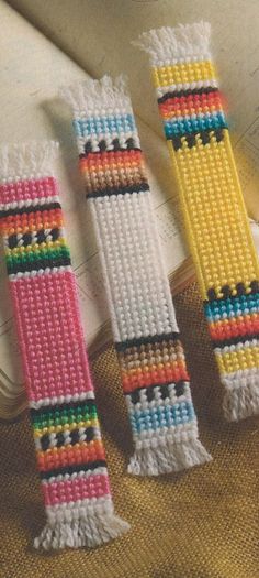 three bracelets made out of different colored beads