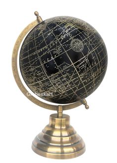 an antique black and gold globe with writing on it