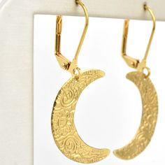 Earrings measure about 1.5" long Gold plated lever-backs Brass earrings Handmade in the USA Handmade in Salem, Massachusetts by WE DREAM IN COLOUR Goldmakers Jewelry Mission Statement Goldmakers Jewelry creates and curates a comprehensive selection of artfully designed hand-crafted jewelry. We aspire to offer the jewelry enthusiast access to affordable classics as well as fresh innovative designs. Handmade Moon-shaped Artistic Jewelry, Handmade Moon Shaped Artistic Jewelry, Handmade Artistic Moon-shaped Jewelry, Artisan Crescent Jewelry Nickel Free, Symbolic Gold Moon-shaped Earrings, Artistic Gold Hoop Earrings As Gift, Symbolic Gold Moon Earrings, Gold Half Moon Pierced Earrings, Artistic Gold Hoop Earrings For Gift