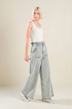 An acid-washed denim pant with front closure and side/back pockets Details: Self: 90% Cotton 10% Viscose Size & Fit - Model is 5`8" And Wearing Size Small- Measurements Taken From Size Small- Approx. Length: 42" Inseam - 30" Acid Wash Denim Mid-rise Bottoms, Spring Acid Wash Denim Flare Jeans, Light Wash Recycled Denim Jeans With Belt Loops, Stonewashed High-rise Cotton Bottoms, High Rise Acid Wash Bottoms, Recycled Denim Light Wash Jeans With Belt Loops, Trendy Bleached Denim Bottoms, Trendy High Waist Acid Wash Pants, Spring Acid Wash Denim Jeans