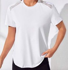 WOW...this T-Shirt is just WAY TOO COOL! Mesh cutouts with a flattering design in back...it is just so comfortable to play a round in or just work out in! Comes in Black or White. We LOVE this t-shirt! 85% Polyester, 15% Elastane Round Neck Medium Stretch Contrast Mesh, Cut Out Imported Summer Crew Neck T-shirt For Light Exercise, Stretch Crew Neck T-shirt For Light Exercise, Sporty Stretch Short Sleeve Workout Top, Sporty Stretch Short Sleeve Top For Workout, White Sporty T-shirt For Light Exercise, Athleisure Short Sleeve Crew Neck Top For Workout, Sporty Short Sleeve Tops For Light Exercise, White Crew Neck Workout Tops, White Crew Neck Tops For Workout