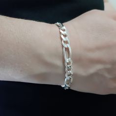 Our product is 925 sterling silver.Thicness 7 mm.Length 8'to 10'.The product will come to you in a gift package.We wish you to use it on a nice day. 7 inch 14.7 gr   8 inch 16.3 gr    9 inch 18 gr   10 inch 19.6 gr Classic Silver Cuban Link Bracelet As Gift, Classic Silver Cuban Link Bracelet Gift, Classic Silver Cuban Link Bracelet For Gift, Elegant Silver Figaro Chain Bracelet, Elegant Silver Bracelet With Figaro Chain, Silver Cuban Link Bracelet With Figaro Chain As Gift, Silver Oval Link Cuban Bracelet For Gift, White Gold Bracelets With Figaro Chain For Gift, Silver Bracelet With Figaro Chain And Oval Link