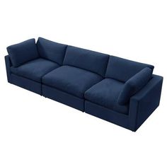 a large blue couch sitting on top of a white floor