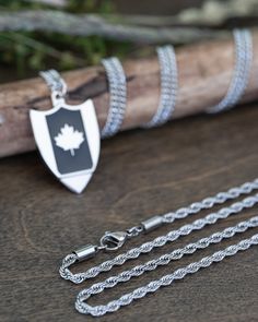 Celebrate the beauty of the Great White North with our Choty Silver Canada Flag Necklace—a striking blend of patriotism and practicality. Crafted with precision and featuring a discreet built-in shotgun tool, this necklace not only honors the maple leaf but also adds a touch of functionality for your beverage-opening needs. The intricately designed silver Canada flag pays homage to the land of the maple, capturing the essence of Canadian pride in every detail. Redesigned over 15 times to achieve Beer Necklace, The Great White, Great White, Design Silver, Tiffany Heart, Canada Flag, Heart Charm Bracelet, Maple Leaf, World's Best