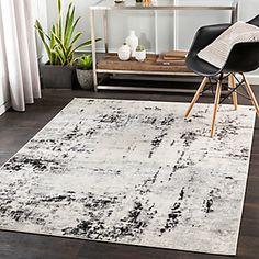 a black and white rug in a living room