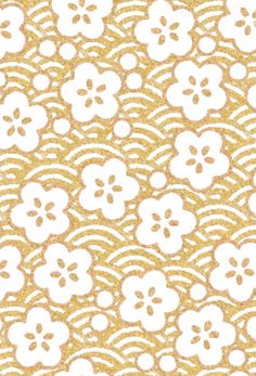 a gold and white wallpaper with flowers on the side, in an ornate pattern