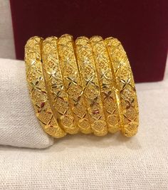 Christmas Gift, Holiday Gift,  24k gold plated Bangles, Indian Bridal Bangles, Handmade Bracelet for Women Gold Bangles for Women - Indian Bridal Bangles - Handmade Bracelet These stylish bangles feature a classic bangle design and are available in gold color. ▶ BEAUTIFUL HINGED GOLD BRACELET ▶ HIGED TO OPEN WIDE----- STAYS SECURELY SHUT -----  LIFT TAB SIDE TO OPEN Material: High quality 24k gold plated bangles ( Not solid gold) Diameter: 2.36 inches Can open Lead & Nickel free Tarnish resistan Gold Jewelry For Christmas Wedding, Gold Plated Bangle Bracelet As Gift, Gold Bangle Bracelets For Festive Occasions, Gold Bangle Bracelet For Festivals And Gifts, Gold Plated Yellow Gold Bracelet For Celebrations, Yellow Gold Plated Bracelets For Celebration, Yellow Gold Plated Bracelet For Celebration, Festival Gift Gold Bangle Bracelet, Yellow Gold Bracelet With Intricate Design Gift