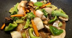 stir fry with vegetables and sauce in a wok