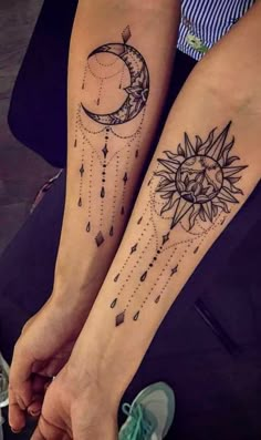 two people with matching tattoos on their legs, one is holding the other's hand