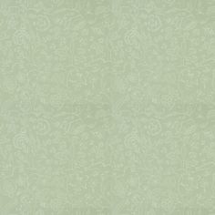 a green wallpaper with white flowers and vines on the bottom right hand corner,