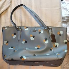 Authentic Coach Purse Never Been Used In Perfect Condition! Pretty Pigeon Blue Color With Flower Design. Chic Blue Floral Print Bag, Elegant Blue Bags With Floral Print, Elegant Blue Floral Print Bags, Blue Floral Print Bags For Shopping, Blue Floral Print Travel Bag, Blue Floral Print Shopping Bags, Pretty Pigeon, Pigeon Blue, Blue Coach