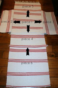 four pieces of cloth laid out on the floor with arrows pointing in different directions to each other