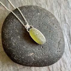 Chunky Olive Green Sterling Silver Sea Glass Pendant NecklaceThis is a sterling silver olive green sea glass necklace that would make a perfect gift for a friend or relative who is hard to buy for. Do you need a great gift for your mom or grandma? This pretty necklace is the perfect gift for someone you love or to wear to a beach wedding! Here are the details: It is a piece of olive green sea glass, that is set in a scalloped bezel with a simple bail. And, it will arrive to you on either a 16” o Natural Stone Necklaces With Recycled Glass For Gifts, Natural Stones Necklace With Recycled Glass For Gifts, Gift Necklaces With Natural Stones And Recycled Glass, Recycled Glass Round Pendant Necklace Gift, Elegant Handmade Sea Glass Necklace, Minimalist Recycled Glass Necklaces For Gifts, Silver Recycled Glass Necklace For Gift, Nickel-free Recycled Glass Necklace As A Gift, Nickel Free Recycled Glass Necklace Gift