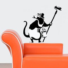 a black and white wall decal with a cat holding a hammer in it's hand