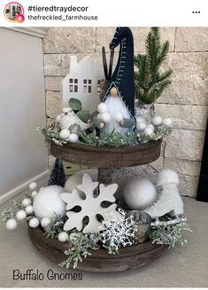 two tiered trays with ornaments and snowflakes