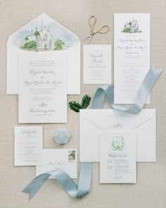 the wedding stationery is laid out and ready for guests