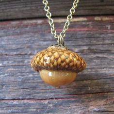 Hand crafted by JonnyB'sArt this necklace is a real acorn nut that is processed and suspended from a 24-inch brass finished base metal chain. Acorn Measures: 1" Tall - 1" Wide A one-of-a-kind piece of fashion jewelry! Acorn Necklace, Base Metal, Metal Chain, Fashion Jewelry