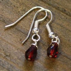 "Adorable earrings with garnet crystal birthstone charm.  Perfect for the January birthday on your list. Earrings measure just over 1\" from top of earwire. ** Earring wires can be exchanged for clip on style earrings-Just add a note to seller at purchase** All other month's birthstones available in my shop." Nickel-free Drop Crystal Earrings For Gifts, Sterling Silver Teardrop Earrings With Lever Back For Gifts, Gift Sterling Silver Teardrop Earrings With Lever Back, Teardrop Crystal Earrings With Ear Wire As Gift, Gift Teardrop Dangle Earrings With Lever Back, Teardrop Crystal Earrings With Lever Back As Gift, Sterling Silver Nickel-free Crystal Earrings As Gift, Teardrop Sterling Silver Crystal Earrings For Gift, Nickel-free Sterling Silver Crystal Earrings As Gift