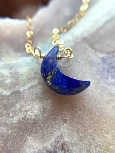 "Stunning 16mm blue Lapis Lazuli Crescent moon pendants have been made into a beautiful crystal necklace. In options of gold or silver this necklace is a show stopper. Perfect gift for that special someone in your life, they will cherish this handmade piece for years to come and will be a luxurious classic necklace to add to their wardrobe. This piece looks great worn alone or layered with other classy pieces. Handcrafted Lapis Lazuli Moon Pendant Necklace *Beautiful gift for her *High quality g Spiritual Blue Moon Necklaces, Sapphire Crystal Necklace For Gift, Spiritual Round Lapis Lazuli Necklace, Blue Spiritual Crystal Necklace With Round Pendant, Blue Moonstone Gemstone Crystal Necklace, Blue Lapis Lazuli Crystal Necklace As A Gift, Blue Lapis Lazuli Crystal Necklace For Gift, Blue Lapis Lazuli Crystal Necklace - Perfect Gift, Blue Moon Charm Necklace For Jewelry Making