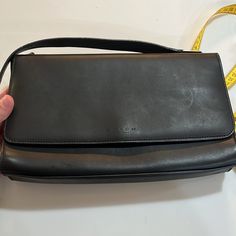 According To Coach: New Coach Bridle Handle Flap, No. 6711, 5268 Slender, Elegant Shape, Outside Back Pocket, Modern Magnetic Snap Closure. 20* Strap. 10 X 6 X.2%, Current Shown. Black Perfect Little Black Vintage Bag! Comment Any Questions! Evening Baguette Tote Bag With Silver-tone Hardware, Classic Evening Tote Baguette Bag, Elegant Coach Baguette Bag For Everyday, Evening Coach Baguette Shoulder Bag, Modern Coach Clutch Shoulder Bag, Coach Evening Baguette Shoulder Bag, Coach Baguette Evening Shoulder Bag, Elegant Coach Baguette Bag With Detachable Strap, Classic Handheld Baguette Bag For Formal Occasions