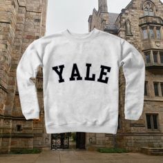 Aesthetic Yale University Sweatshirt, Vintage Y2K Illustrated Oversized Sweatshirt, Cute Sweater, Pinterest NYC, Womens Sweatshirts, Tumblr Ideal for any situation, a unisex heavy blend crewneck sweatshirt is pure comfort. These garments are made from polyester and cotton. This combination helps designs come out looking fresh and beautiful. The collar is ribbed knit, so it retains its shape even after washing. There are no itchy side seams on these sweaters.  - Made with a medium-heavy fabric bl Yale University Sweatshirt, Oversized White Sweatshirt For Campus, Oversized School Spirit Tops For Campus, Collegiate Winter T-shirt For Streetwear, Vsco Crew Neck Sweatshirt For Streetwear, Oversized White Sweater With Text Print, White Relaxed Fit Sweatshirt For Campus, White School Spirit Sweatshirt For Streetwear, White Varsity Sweater For Streetwear